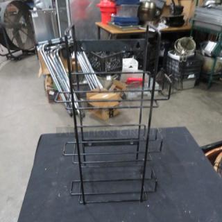 Black wire holder, three-tiered, in good condition. Suitable for organizing, with sturdy metal construction.