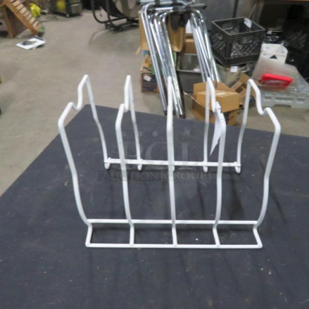 White metal plate holder, six slots, good condition, ideal for organizing or display.