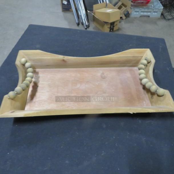 Wooden tray/holder, 17x10 inches. Features bead handles, natural wood finish. Appears in good condition.