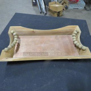 Wooden tray/holder, 17x10 inches. Features bead handles, natural wood finish. Appears in good condition.