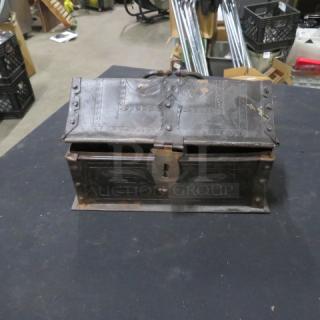 Antique decorative tin holder with intricate engraved patterns, hinged lid, and latch. Some rust visible.