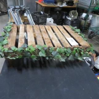 Wooden display stand with slatted top, 21x15x6 inches, adorned with artificial ivy. Auction tag visible.