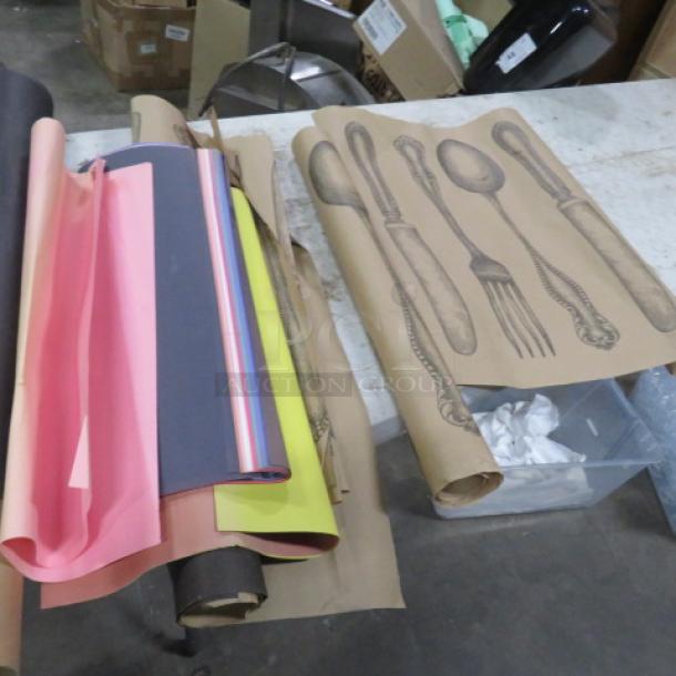 One lot of miscellaneous paper rolls with colorful graphic designs and vintage cutlery illustrations; condition varies.