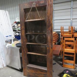 Vintage multi-use door with custom shelving, 36x83.5 inches, for liquor display. Rustic wood finish, good condition.