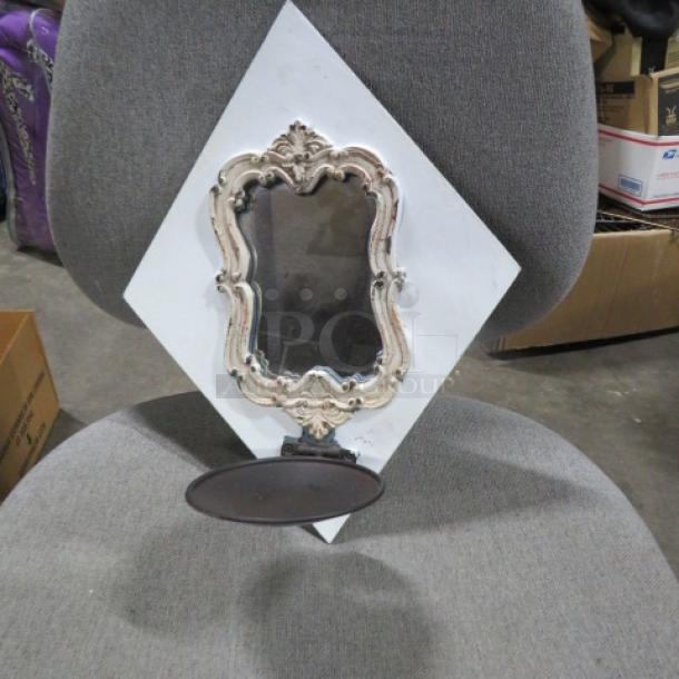 Ornate wooden wall mount mirror candle holder with vintage design, silver frame, and single candle plate. Good condition.