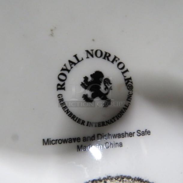 10.5-inch Royal Norfolk plate, featuring a black lion emblem. Greenbrier International; microwave and dishwasher safe. Made in China.