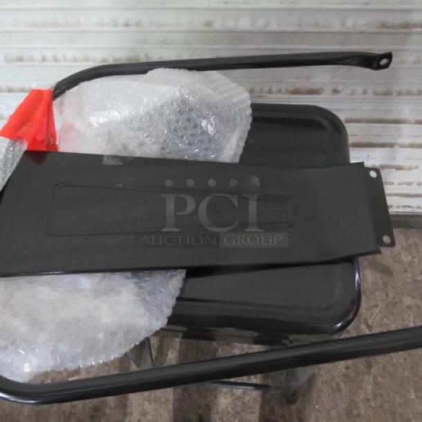 Black metal industrial bar height chair, new condition, parts shown for assembly, includes back panel.