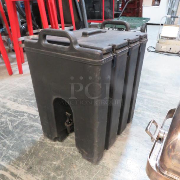 Cambro beverage dispenser model 1000LCD in black. Durable plastic, stackable with secure latches. Used condition.