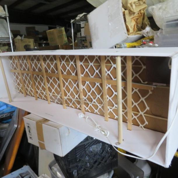 New Wonderfall XL Snow Box, eight-hour duration, priced at $129.95, features grid design and electrical cord.