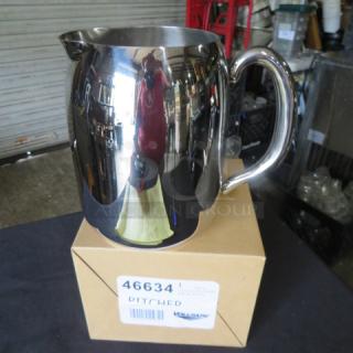 Vollrath stainless steel pitcher, 68oz, model 46634, new condition, reflective finish, on box labeled with model and brand.