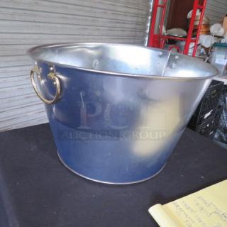 One 16x10 metal beverage tub with gold handles, in good condition. Ideal for entertaining or display.