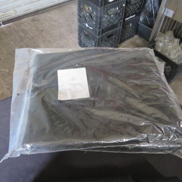 New black table skirt, 168x29 inches, in original packaging. Clear plastic cover with white label displayed.