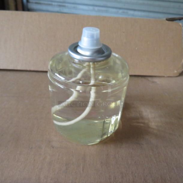 New case of 36 Hollowick 42-hour liquid candles, model HD42. Clear container with visible wick, priced at $95.40.
