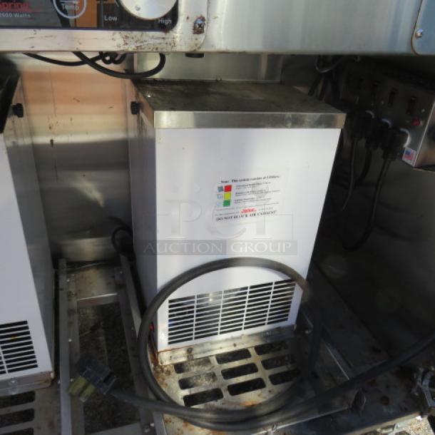 Spring mobile induction range with two doors, three burners, and two air filter systems. Model ICS348-26, 48x24x44 inches.