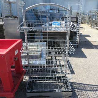 Metal shelving system with 5 wire shelves on casters. Measures 29x17x59 inches. Features a curved top handle.