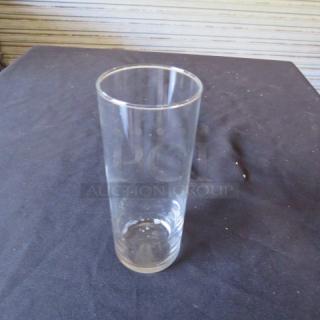 Clear bar/cocktail glass, cylindrical, in excellent condition, no visible markings. Ideal for serving mixed drinks.