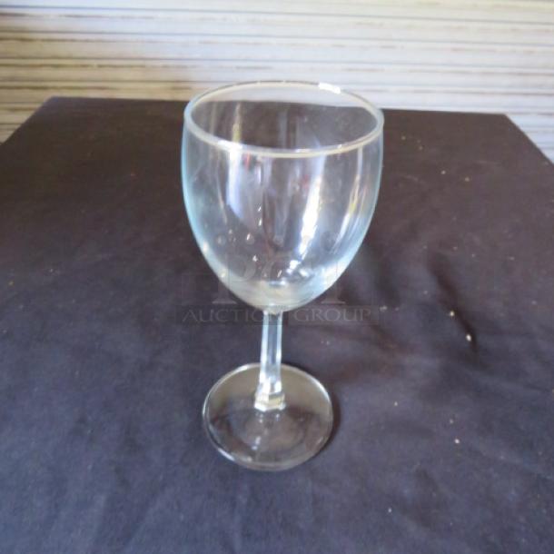 Clear stem wine glass, elegant design, excellent condition, reflective surface, perfect for wine enthusiasts.