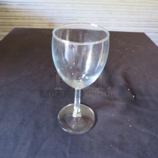 Clear glass stem wine glass, model 10XBID, in good condition. Simple design, no visible markings.