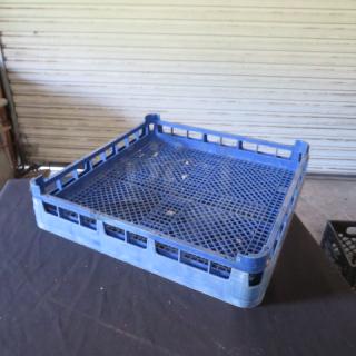Blue flatware dishwasher rack, sturdy plastic, grid design, slightly worn with visible clean condition, ideal for efficient storage.