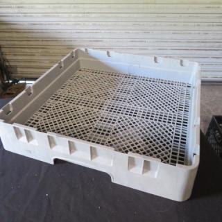 Gray flatware dishwasher rack with a lattice grid design; sturdy plastic construction; good condition; suitable for industrial use.
