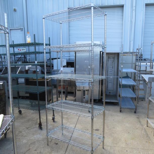 Metro shelf unit with 5 adjustable wire shelves, 36x18x87 inches, chrome finish, excellent condition, ideal for storage.