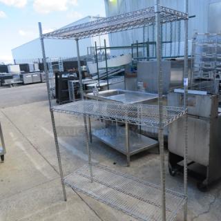 Metro metal shelf unit with three wire shelves, 48x18x73 inches, sturdy condition, ideal for storage and organization.