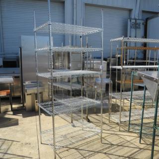 Metro five-shelf unit, 36x24x86 inches, metal wire construction, used condition, sturdy and spacious for storage.