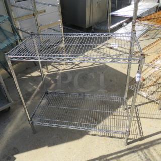 Metro metal shelf unit, two shelves, 36x18x34 inches. Sturdy construction, ideal for storage. Good condition.