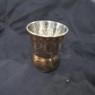 Copper-finished Moscow Mule mug with a hammered texture, shiny interior, and bulbous base, in good condition.