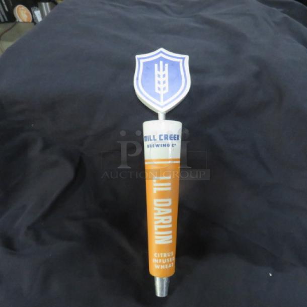 Mill Creek Brewing Co. beer tap handle, "Lil Darlin," citrus-infused wheat design, shield emblem on top, good condition.