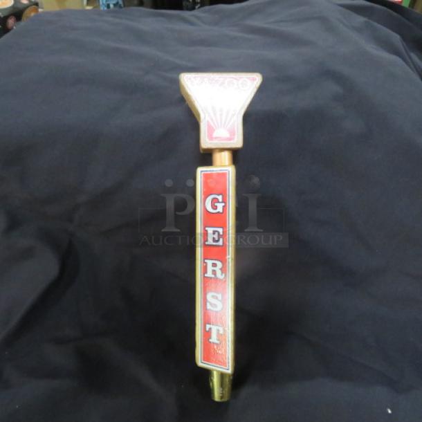 Gerst beer tap handle with red lettering, gold accents, and a harp logo. Good condition. Vintage collectible item.