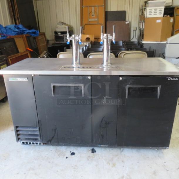 True 2 Door Keg Box with 2 Towers, 4 Taps, Model TDD-3-HC. Right door needs attachment. Measures 69x28x35.5 inches.