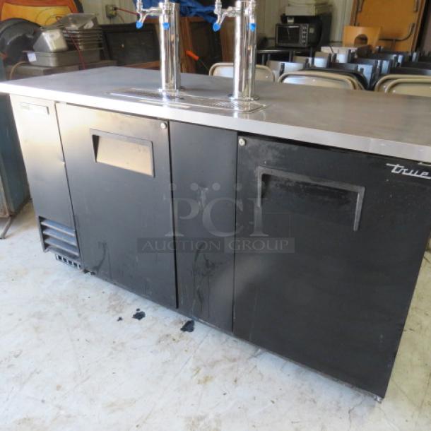 True TDD-3-HC 2-door keg box, 69x28x35.5 inches, with 2 towers, 4 taps, drain. Right door needs top attachment. Model #TDD-3-HC.
