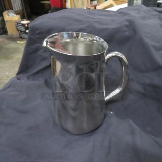 Vollrath stainless steel 76oz water pitcher, model 46390, new condition. Polished finish, ergonomic handle.
