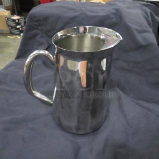 NEW Vollrath stainless steel water pitcher, model 46390, 76oz capacity, pristine condition, sleek design.
