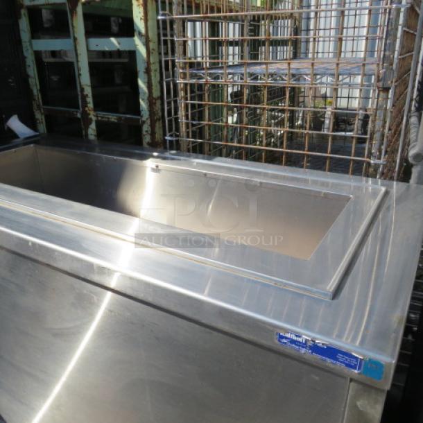 Vollrath stainless steel refrigerated cart, model 36652, on casters. Size 52x25x35.5 inches. 120V. Visible label shows model details.