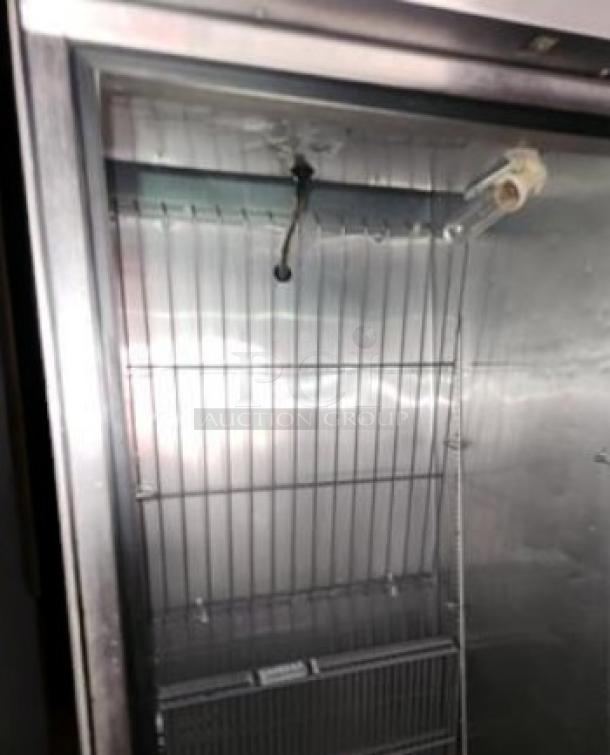 True T-23F-HC single-door reach-in freezer, pristine condition, stainless steel interior, 115V, shelving visible.
