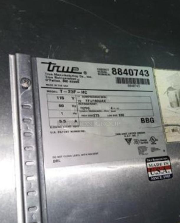 Label on True T-23F-HC Single Door Reach-In Freezer; shows model, 115V specs, and "Made in USA" marking.