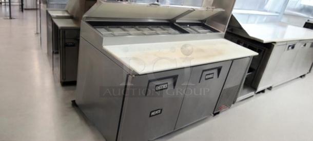 True TPP-67, 67" 2-door pizza prep table refrigerator. Outstanding condition, labeled "Cheeses" and "Meats." Fully tested, 115V.