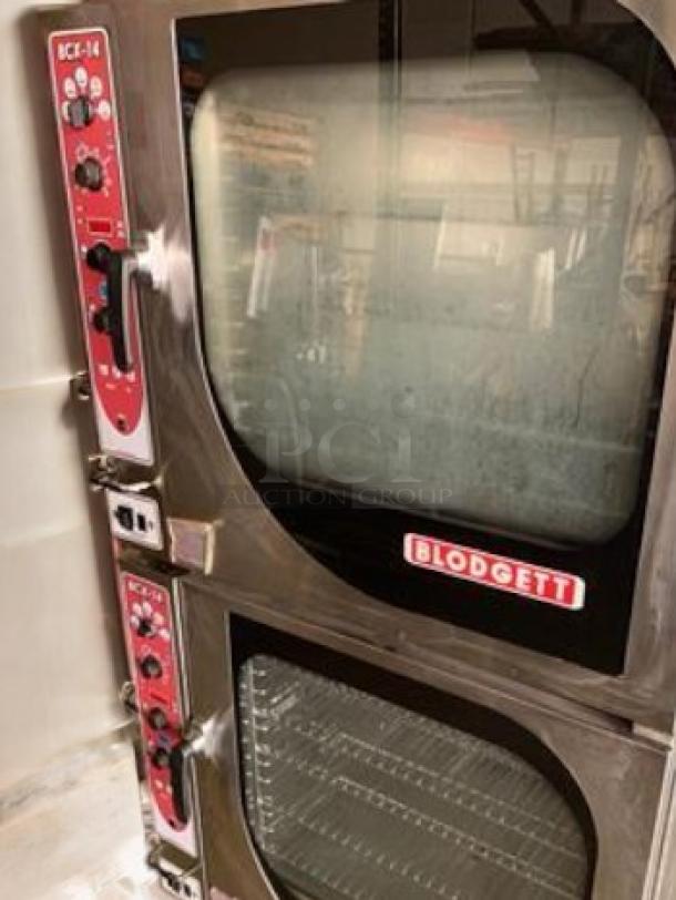 Blodgett BCX-14G double stacked gas combi oven steamer, 230,000 BTU, fully tested, red control panels, “Blodgett” label visible.