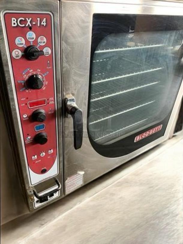 Blodgett BCX-14G double stacked gas combi oven/steamer, top-tier condition, fully tested, 230,000 BTU, visible controls.