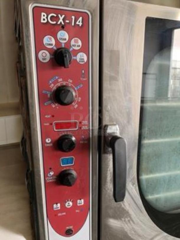 Blodgett BCX-14G double stacked gas combi oven steamer, 230,000 BTU, control panel with dials and buttons, top-tier condition.