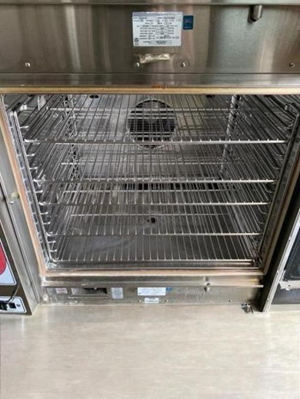 Blodgett BCX-14G double stacked gas combi oven steamer, 230,000 BTU, excellent condition, fully tested, visible control panel.