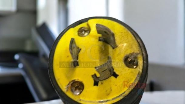 Close-up of a 220-240V plug for a Klub R2 2-Group Commercial Espresso Machine, showing four prongs and a yellow base.