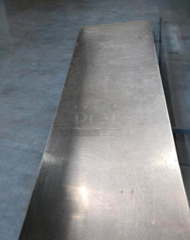 Stainless steel work table, 72" x 30", with undershelf, great condition, Economy model by Generic Commercial Foodservice.