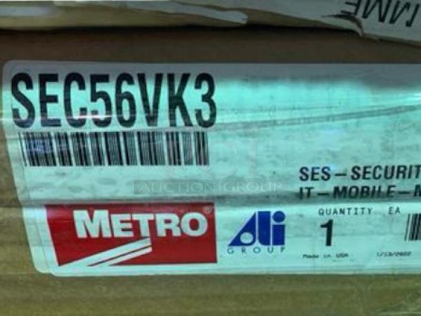 Brand new Metro SEC56VK3 mobile security cage cabinet in original packaging, 24"x36"x63", model and brand labels visible.