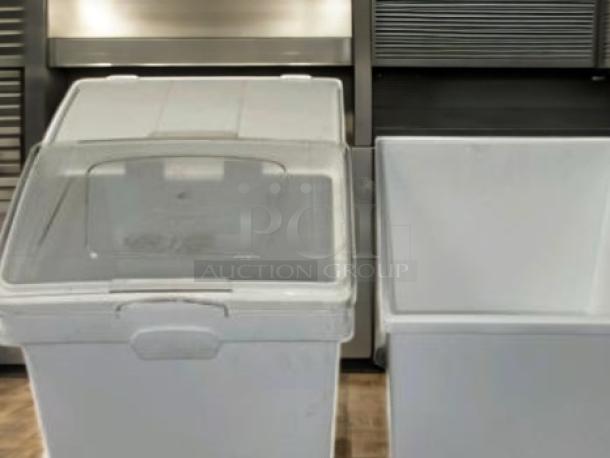 Set of three commercial-grade ingredient storage bins on casters with clear sliding lids and scoops. Superb condition.
