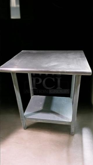 Brand new 30"x30" stainless steel work table with undershelf. Heavy-duty construction, perfect for commercial foodservice use.