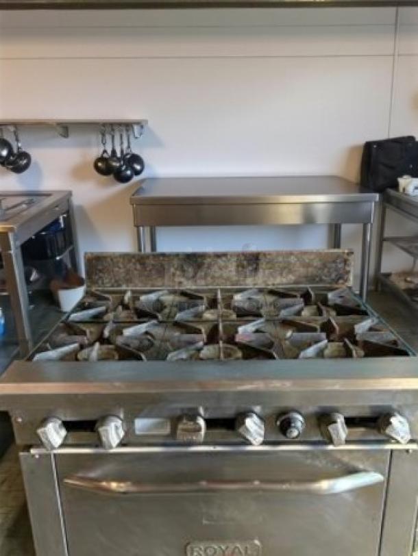 Commercial 6-burner gas range with oven, stainless steel, natural gas, great condition, fully tested and operational.
