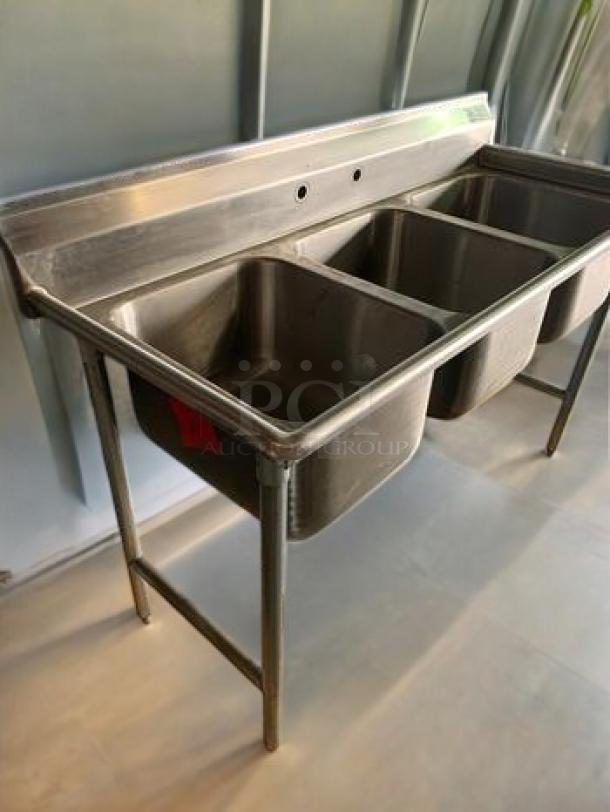 Brand new Advance Tabco T9-3-54 stainless steel 3-compartment sink with backsplash, NSF certified, made in USA.